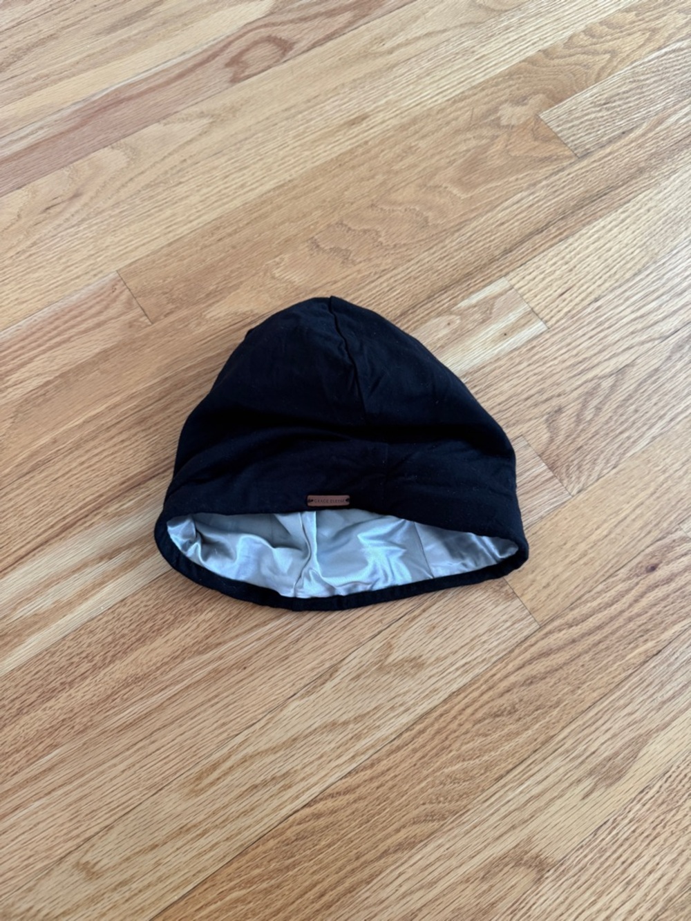 Grace Eleyae satin lined cap bonnet in black with silver lining